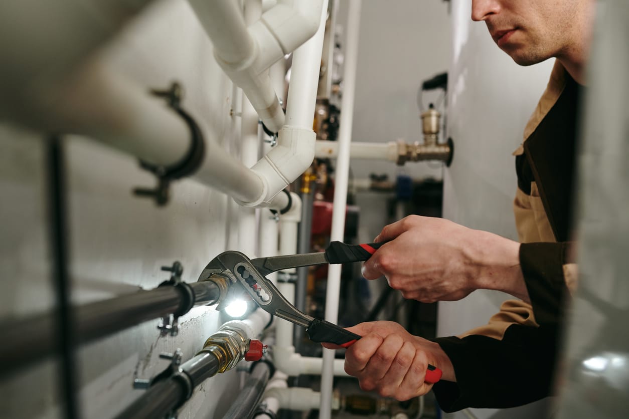 Plumbers maintaining commercial plumbing pipes in Winter Haven
