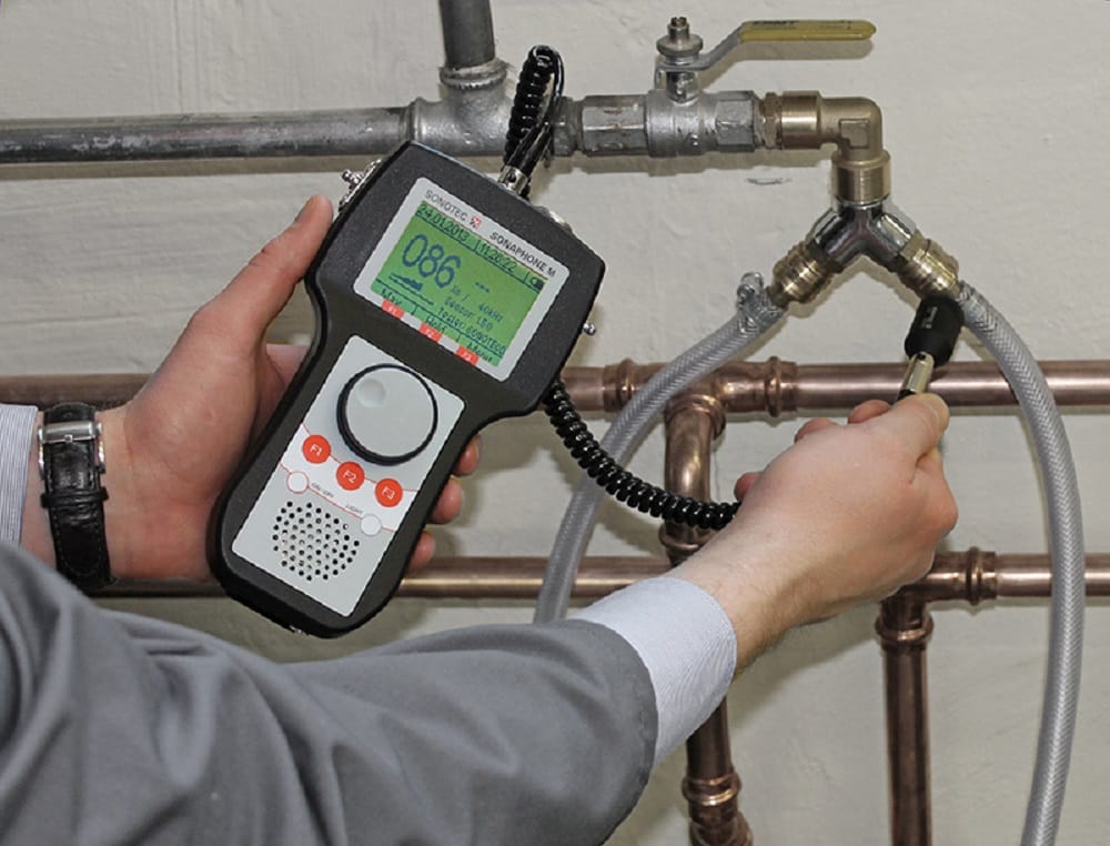 Plumber testing pipes with electronic leak detection equipment in Winter Haven
