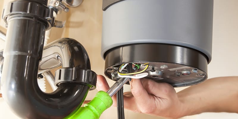 Technician repairing the heating element of a water heater in Winter Haven